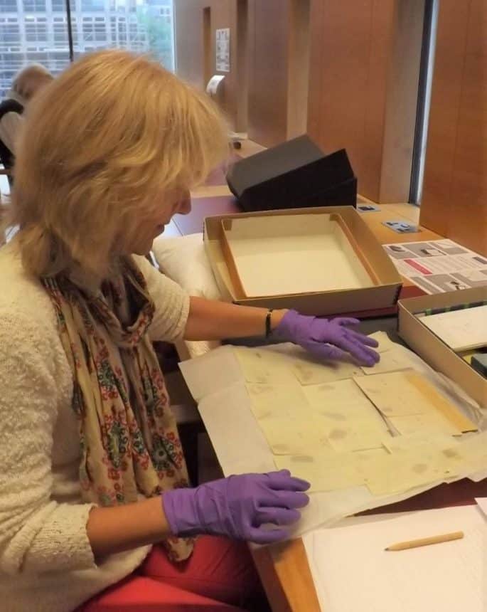 Joan Taylor examining the Dead Sea Scrolls.